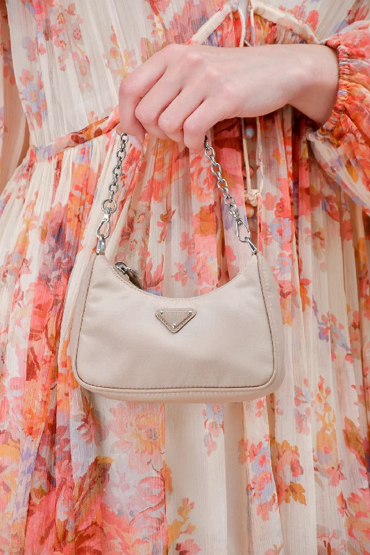 Iconic Handbags At Unbeatable PricesPrada Beige Nylon Mini Re-Edition 2005