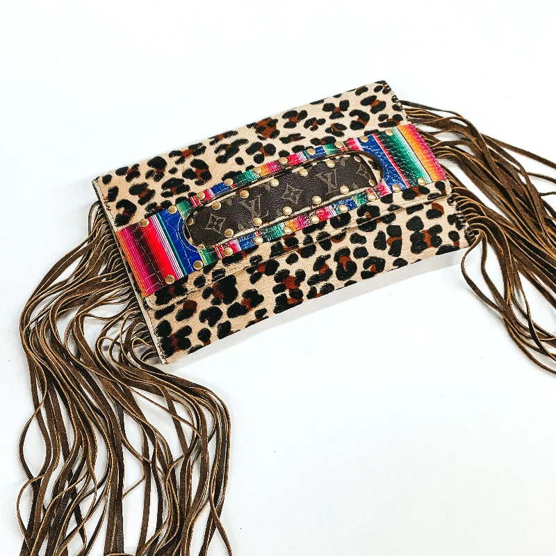  Huge Handbag Markdowns – Update Your Collection NowKeep It Gypsy | Sloan Leopard Print Clutch with Serape Design and Genuine Leather Fringe