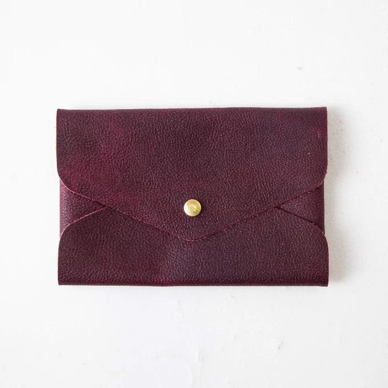  Premium Handbags At Budget-Friendly PricesPurple Kodiak Envelope Clutch