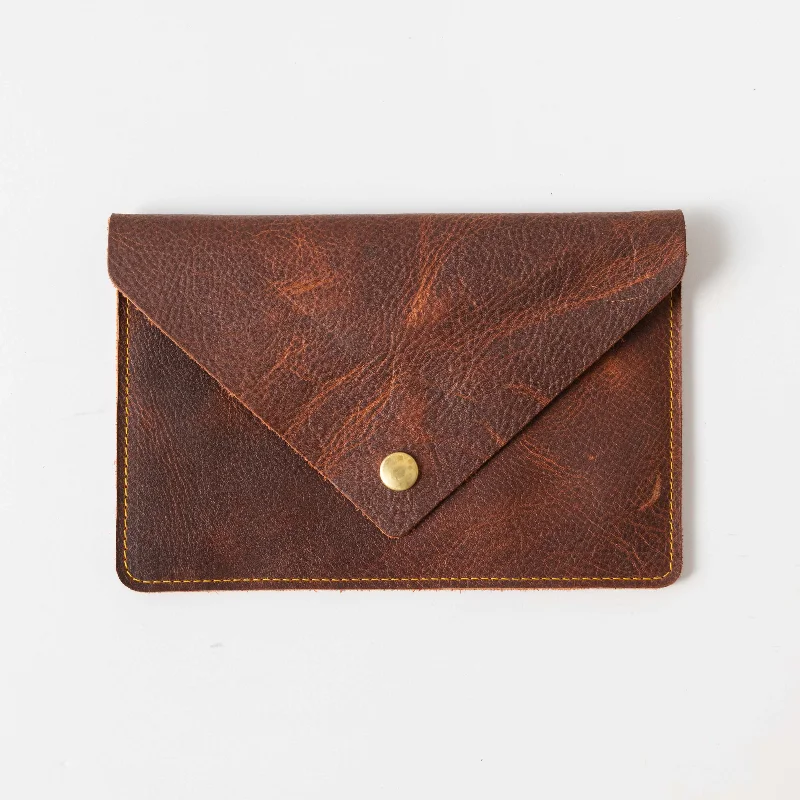  Must-Have Bags At Irresistible DiscountsTan Kodiak Leather Clutch